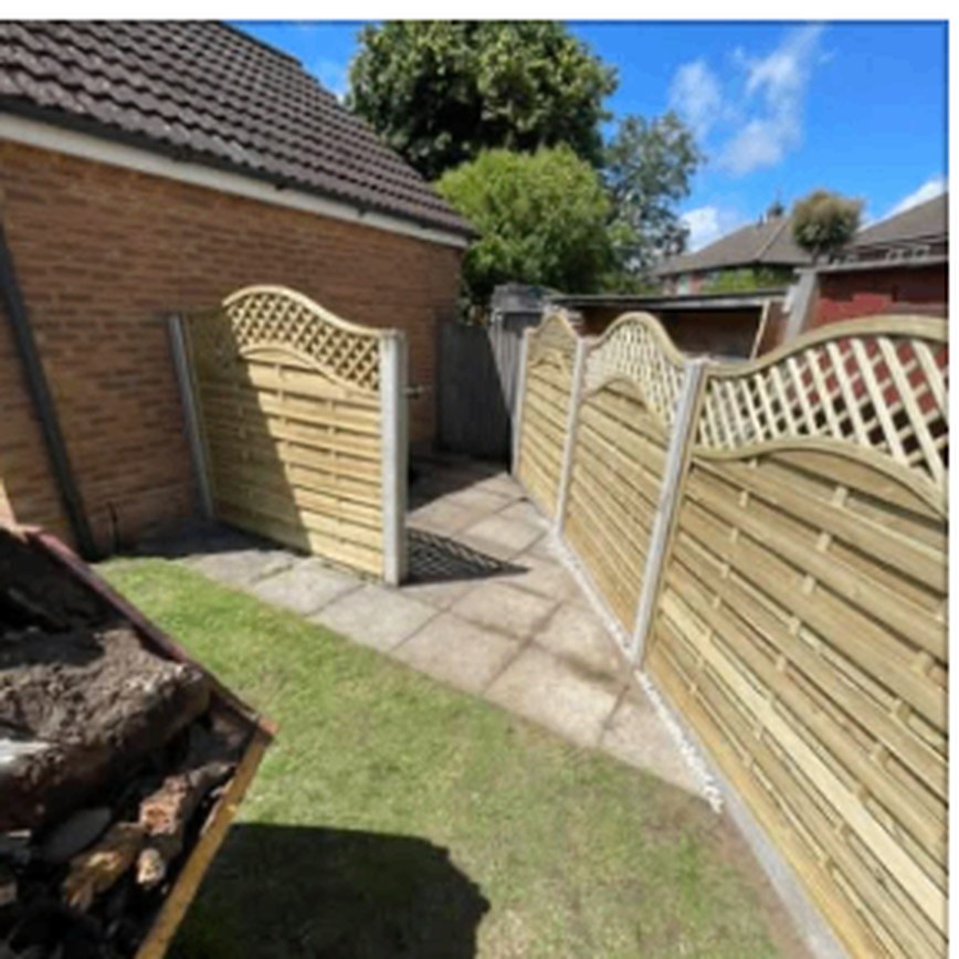 Arched timber fence panels with lattice tops