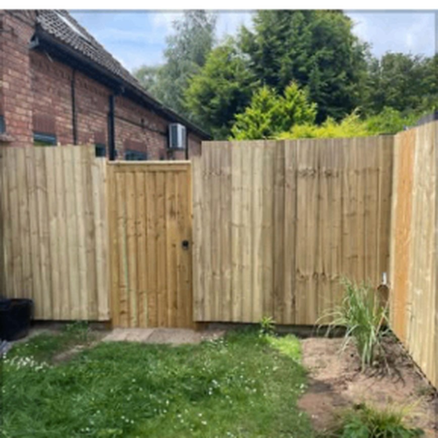 Fence panels and matching gate in a garden corner