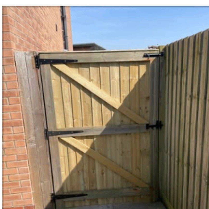 Timber gate with diagonal bracing and black ironmongery