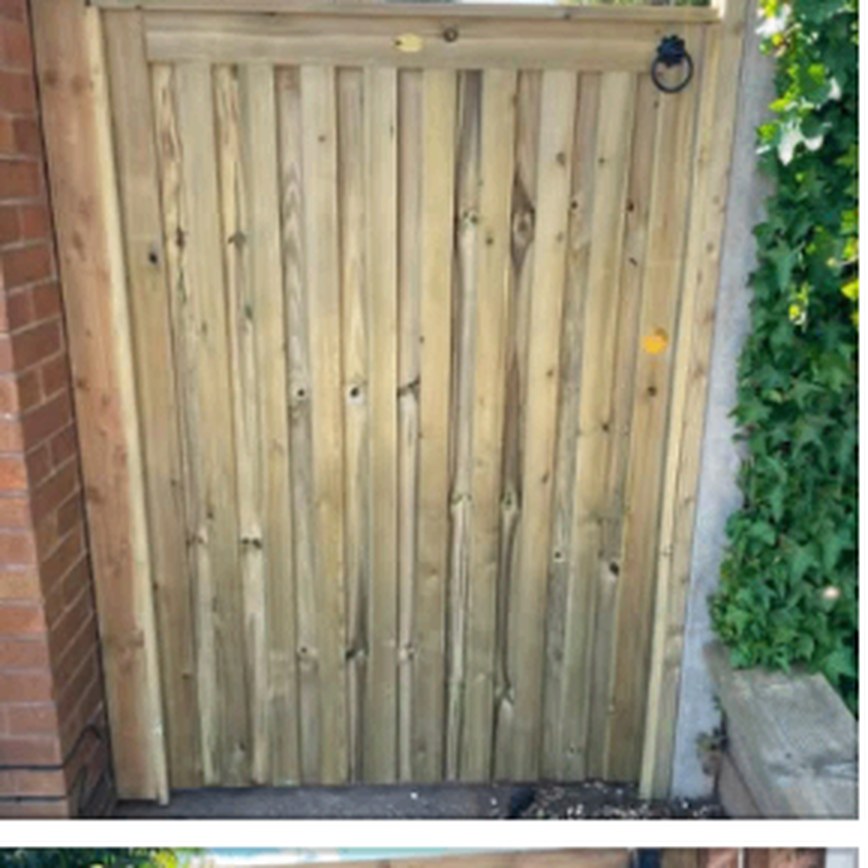 Handmade timber garden gate with a black ring handle