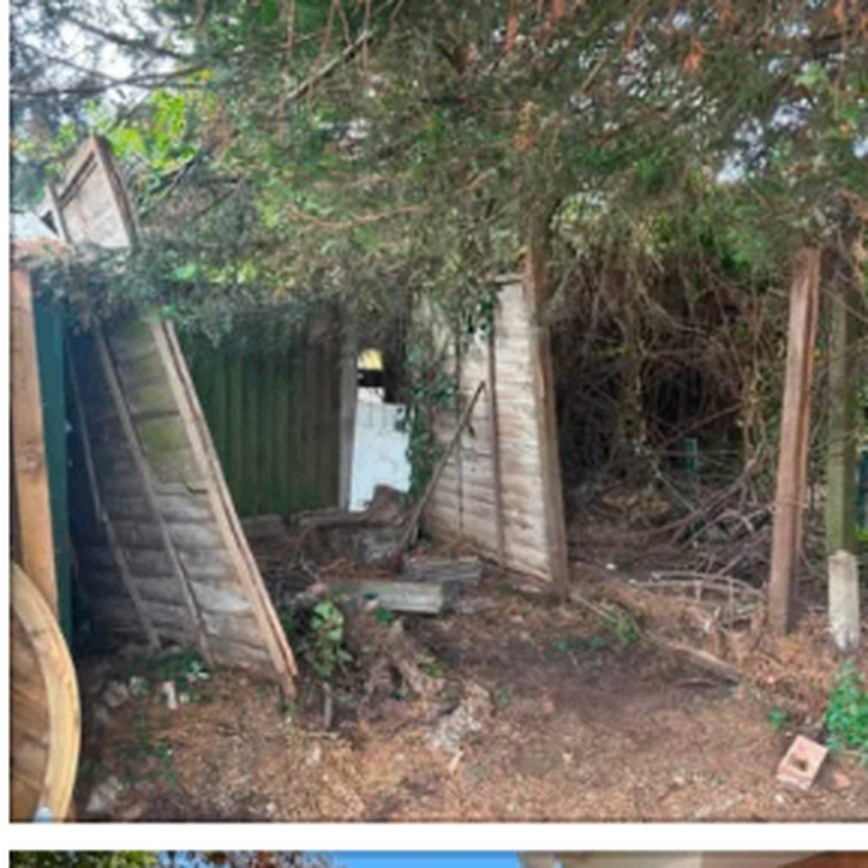 Old leaning timber fence in need of replacement